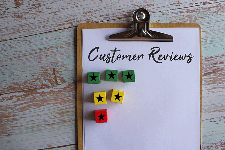 A clipboard containing customer reviews